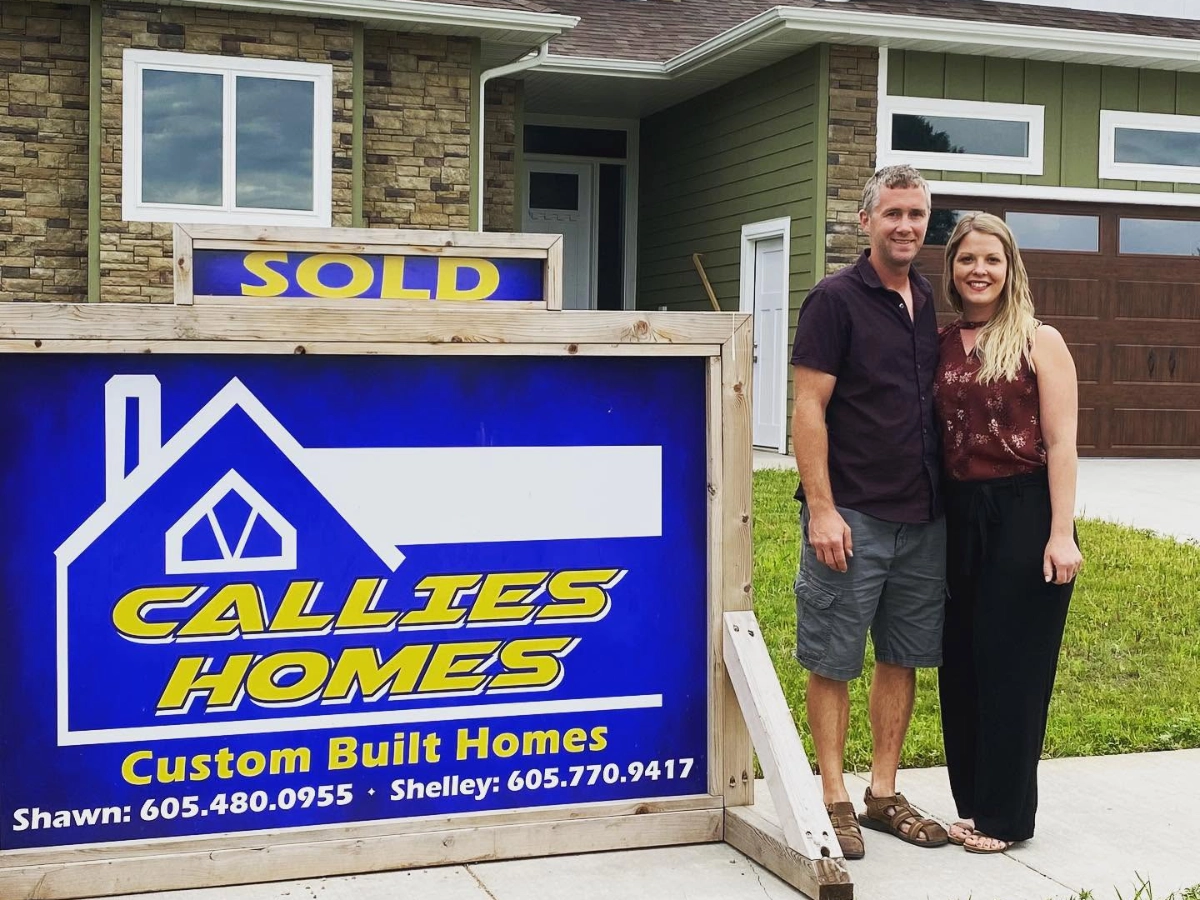 Callies Homes team standing outside a home