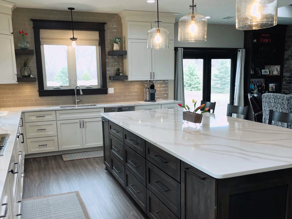 Completed kitchen with new cabinetry, countertops, and lighting