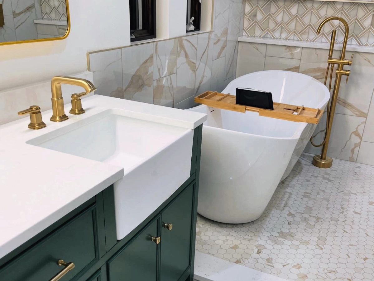 Completed bathroom with new cabinets, countertop, and bath